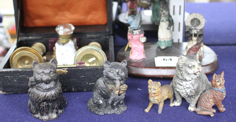 A group of assorted ornaments all relating to cats, comprising: boxed four piece desk set, a painted spelter three cat ornament, two fu